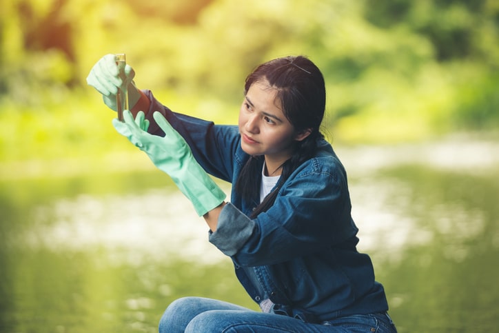 woman-checking-stream-water